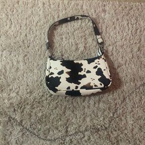 black white and brown cow print purse